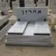 מצבה זוגית אפורה עם תיבת ניירות נשמה